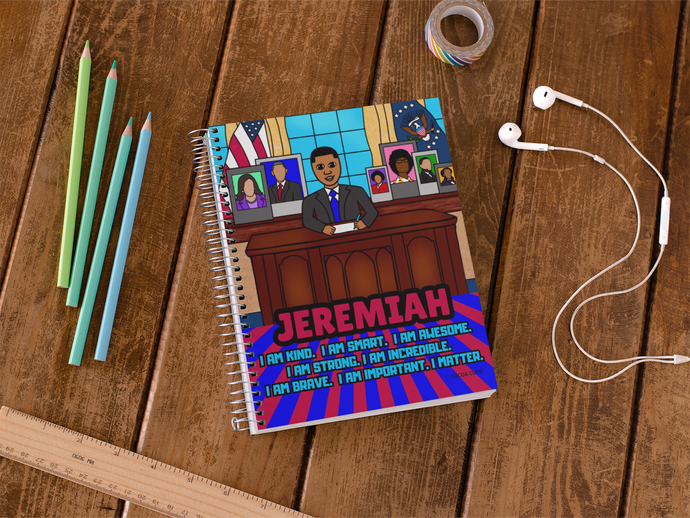 Black president boy in oval office surrounded by pictures of past black political pioneers. notebook contains positive affirmations on front and inside cover. Spiral notebook. Cocoa Cutie